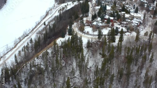 Aerial Drone fly over Alberta Edmonton Valley Ridge park by the Massive Homes of Glenora Winter Birds Eye View by the North Saskatchewan River just a few meters from the Governemnt House Property 2-4 photo