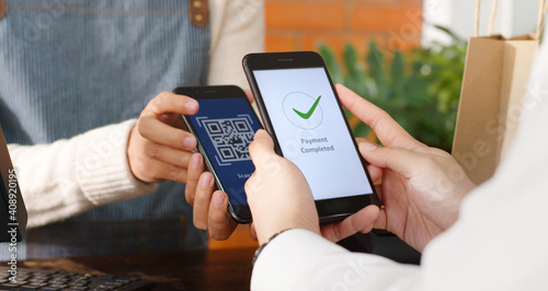 Photography Customer using phone for payment at cafe restaurant, cashless technology and mon