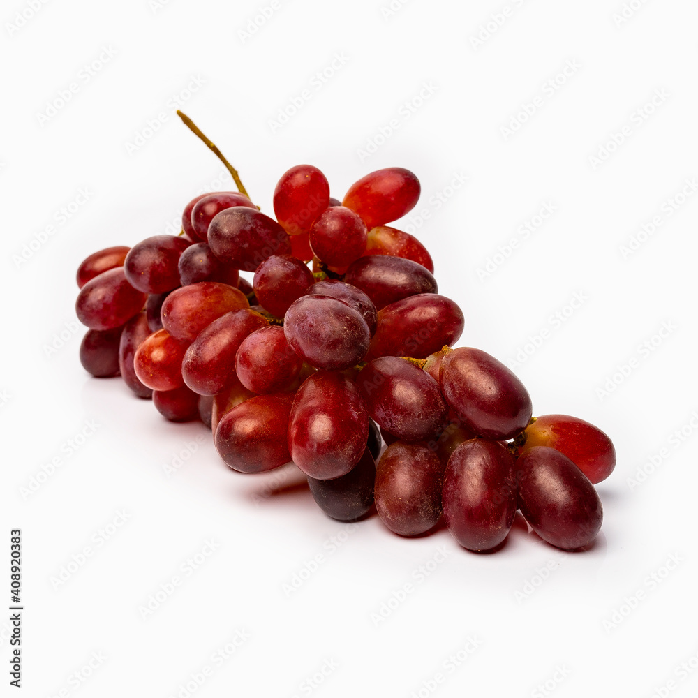 Fototapeta premium red grapes on a white background with reflected shadows