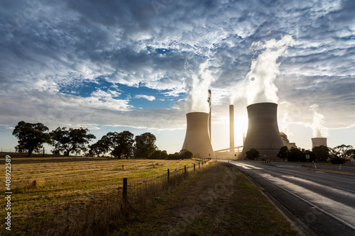 Smokestacks and cooling towers of coal fired power plants. photo