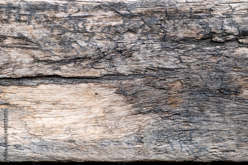 Old wood texture. Old brown wooden plank with rough surface and texture.
