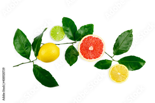 Flat lay composition with citrus fruits, leaves and flowers on white background. photo