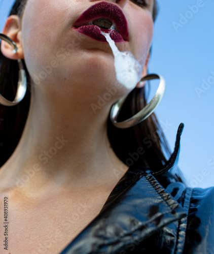 Female domination. Woman spit. Fetish. BDSM concept. Submissive.