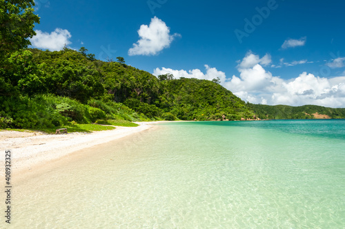 Crystal clear water and mountains make the perfect Iida beach backdrop for a swim. Iriomote Island.