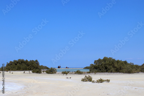 Fototapeta Naklejka Na Ścianę i Meble -  An old wreck on the shore outside the mangrove lagoon