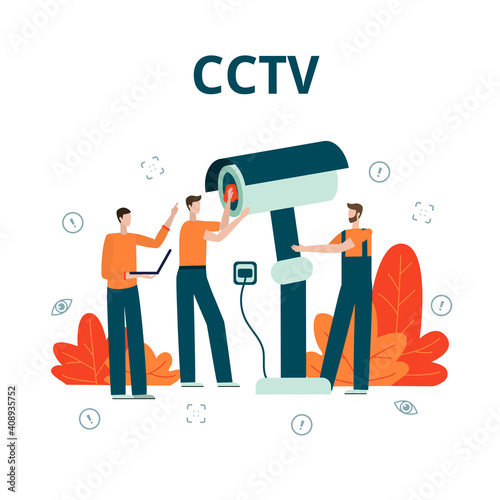 Three service workers assemble and set up a video camera for surveillance. CCTV installation concept.