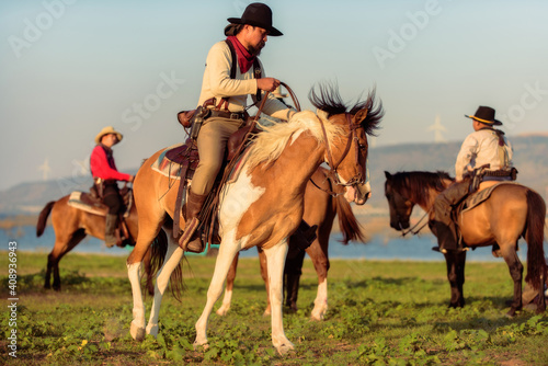 Western cowboys riding horses  © weerachai