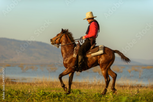 Western cowboys riding horses 