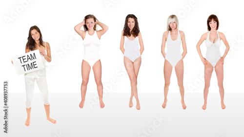 Swim coach holding a placard in front of her swim team, team time is written on the paper in her hand