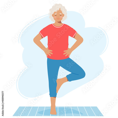 Mature elderly woman performs the exercise standing on the mat. Isolated on a white background.