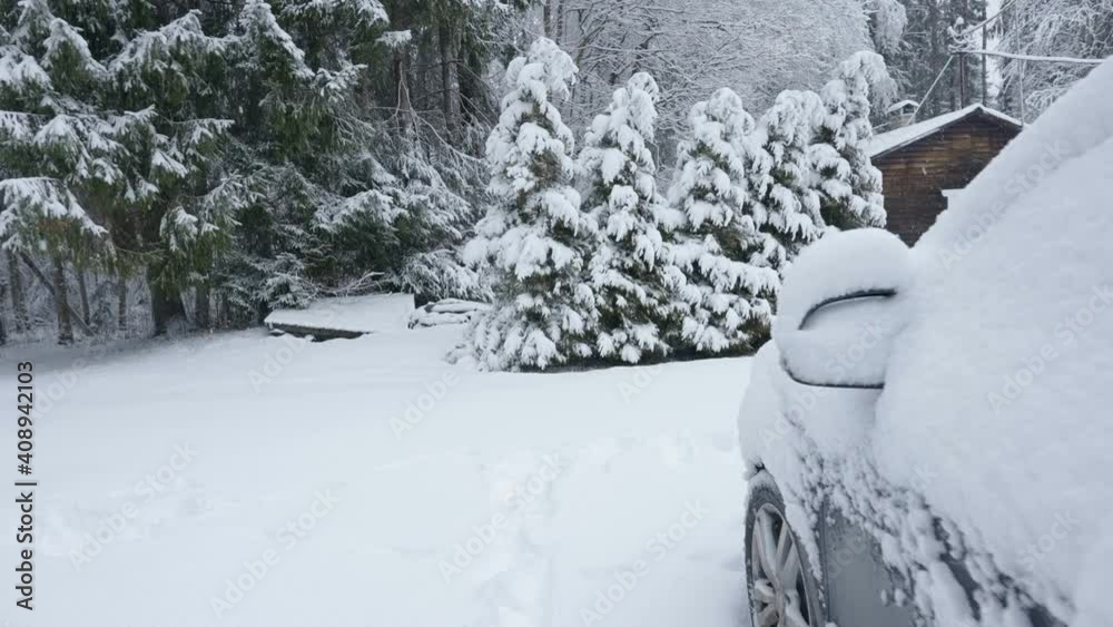 The car covered with the thick white snow on a winter season The car covered with the thick white snow on a winter season
