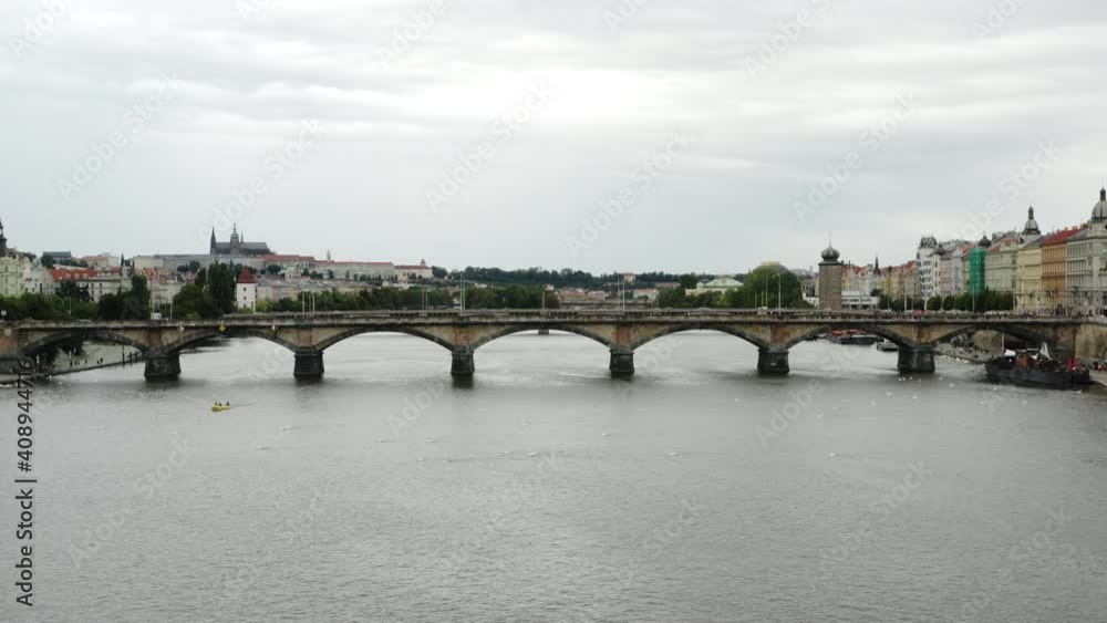 Low aerial push-in shot of Palacký Bridge over Vltava River in Prague Low aerial push-in shot of Palacký Bridge over Vltava River in Prague