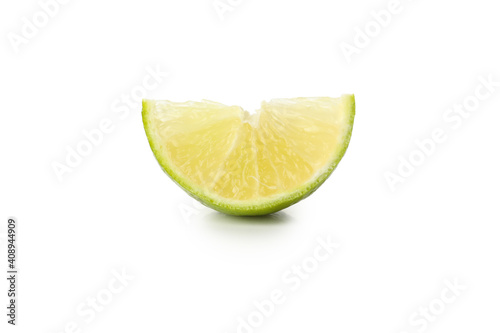 Ripe lime slice isolated on white background