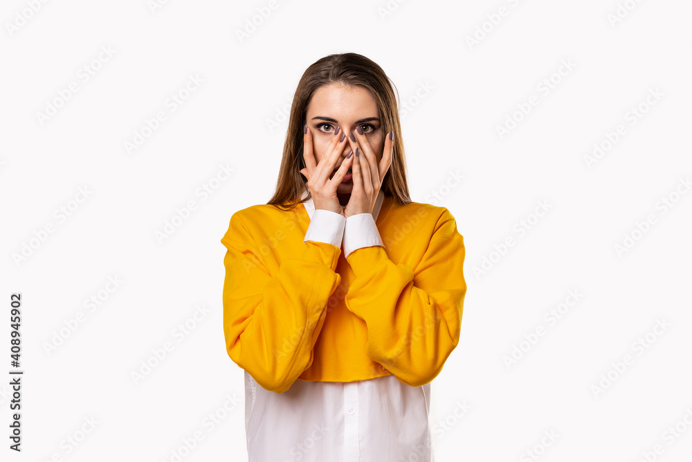 Worried, scared girl hold hands near face with open mouth, as hear something exciting, standing white background Worried, scared girl hold hands near face with open mouth, as hear something exciting, standing white background