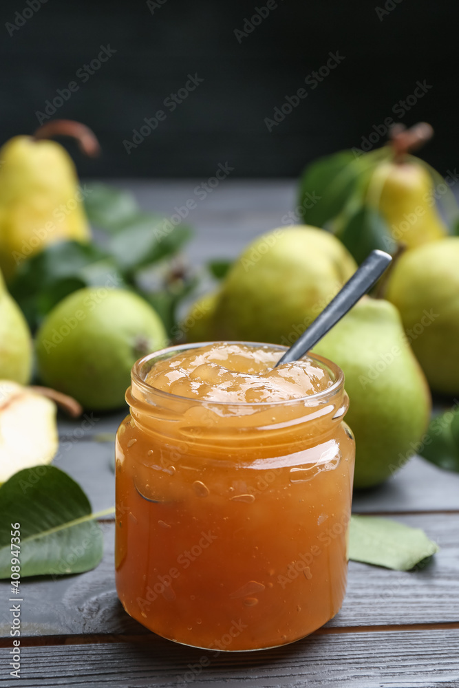 Delicious pear jam and fresh fruits on grey wooden table. Space for text Delicious pear jam and fresh fruits on grey wooden table. Space for text