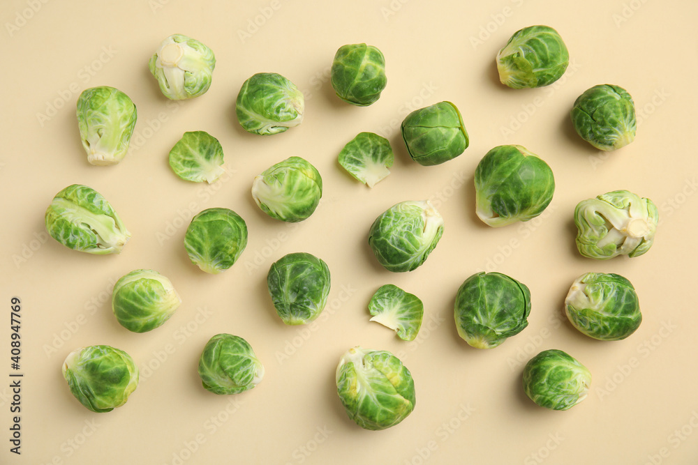 Fresh Brussels sprouts on beige background, flat lay Fresh Brussels sprouts on beige background, flat lay