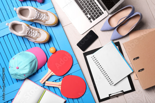 Flat lay composition with business supplies and sport equipment on color background. Concept of balance between work and life photo
