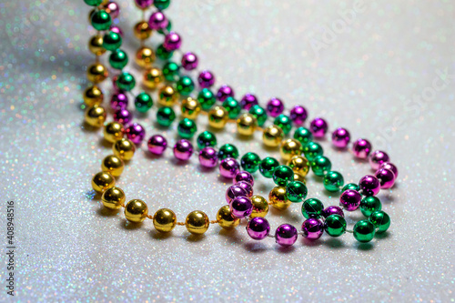 Leinwand Poster Macro defocused abstract view of traditional three-color Mardi Gras beaded costu