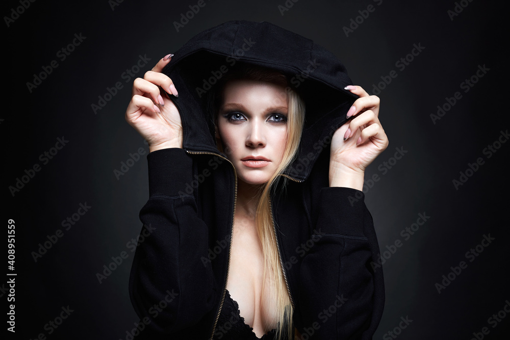 beautiful blond woman in hood. pretty girl with smokey eyes beautiful blond woman in hood. pretty girl with smokey eyes