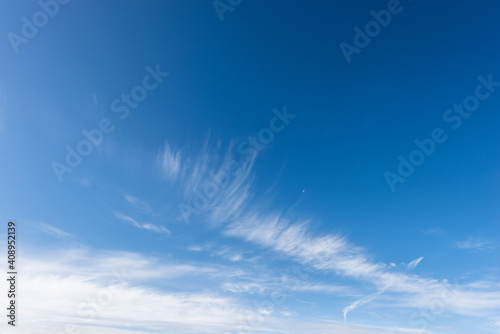 Blue Clear Sky with White Clouds and the Moon - Photography  background.