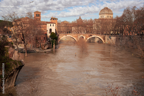 River Tiber in flood, the docks of the Tiber Island are submerged in water