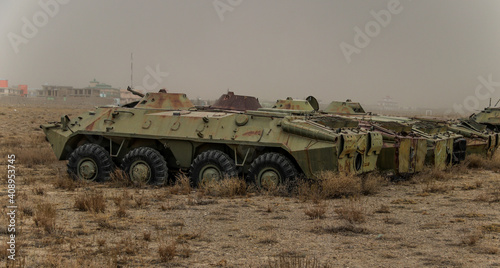 Old armoured vehicles military escorts, guns and tanks in Gardez in Afghanistan photo
