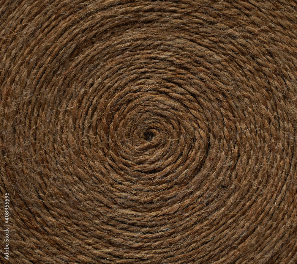 Circle made of jute rope as background. Closeup. Vintage, retro, home decor, country concept. Circle made of jute rope as background. Closeup. Vintage, retro, home decor, country concept.