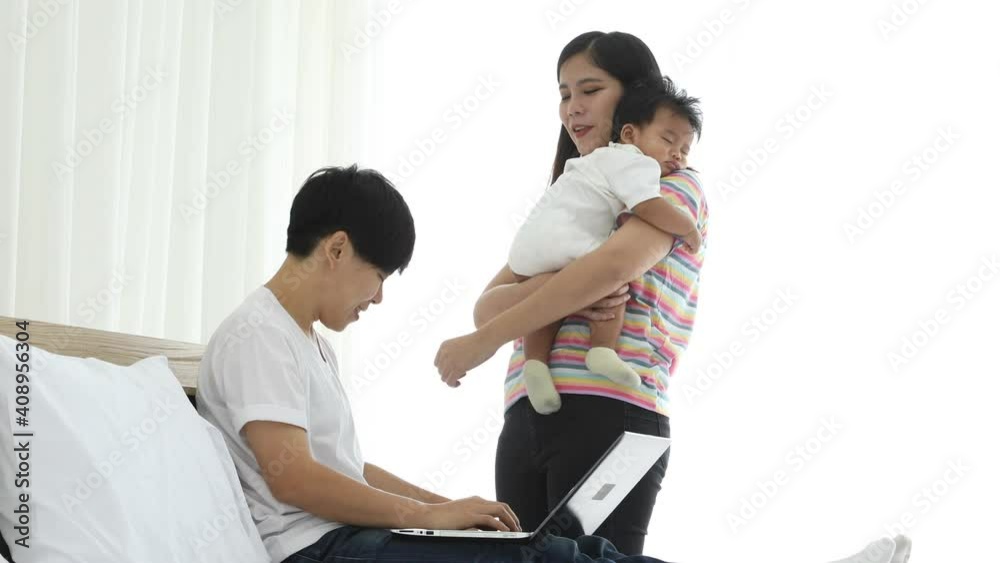 Asian lesbian couple discuss and order online shopping for little baby boy. Happy LGBT family with child Asian lesbian couple discuss and order online shopping for little baby boy. Happy LGBT family with child