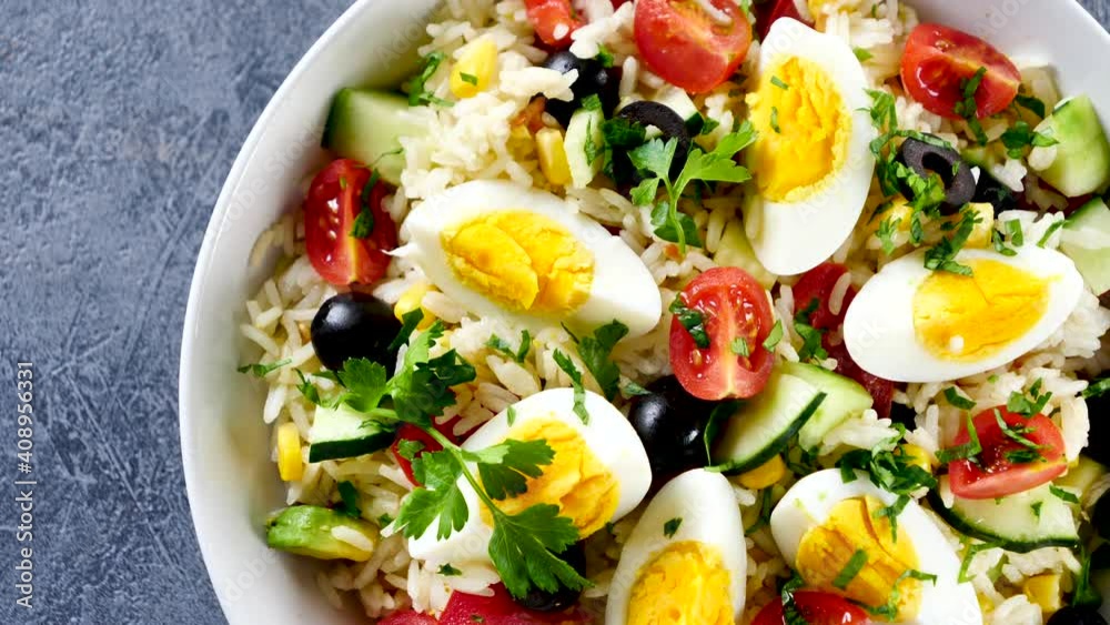 vegetable salad with rice, tomato, cucumber and egg vegetable salad with rice, tomato, cucumber and egg