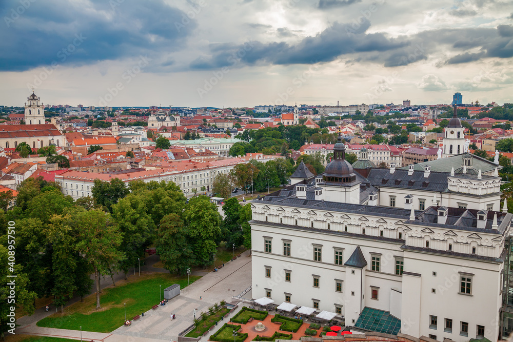 Old town in Vilnius with small houses, churches and red tiles