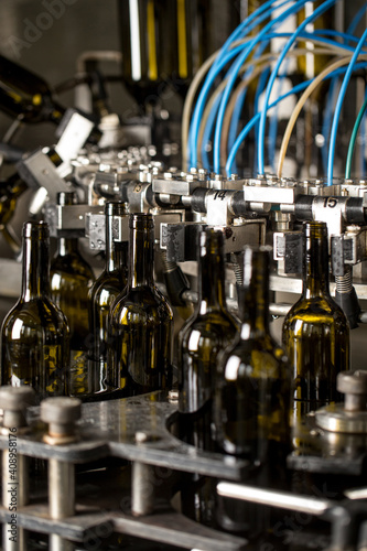 Empty wine bottles on conveyor