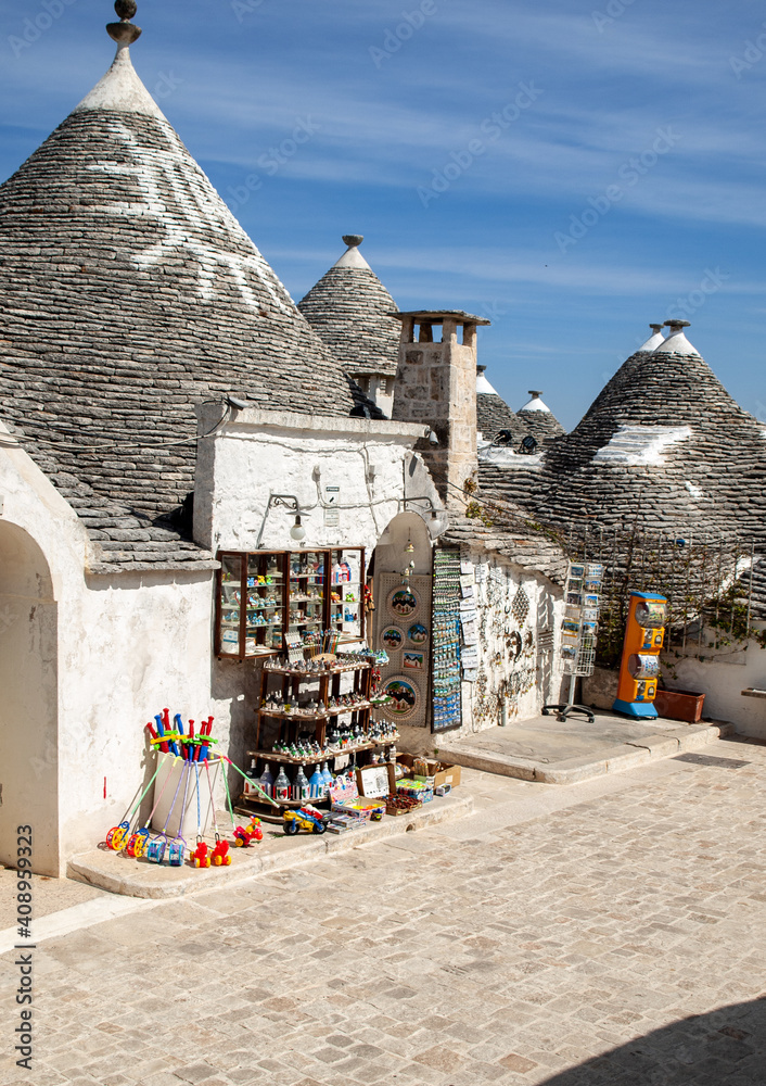 Apulia Symbol Souvenir shop in traditional white trulli house with conical roofs and ...