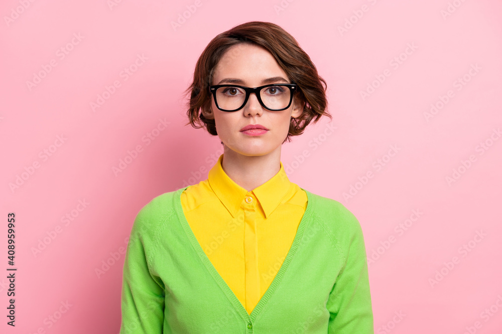 Photo of smart confident young woman wear green cardigan spectacles isolated pastel pink color background Photo of smart confident young woman wear green cardigan spectacles isolated pastel pink color background