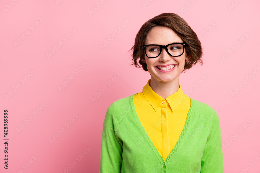Photo of cute sweet young woman wear green cardigan spectacles looking empty space isolated pastel pink color background Photo of cute sweet young woman wear green cardigan spectacles looking empty space isolated pastel pink color background