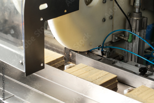 Waffle on conveyor at manufactory