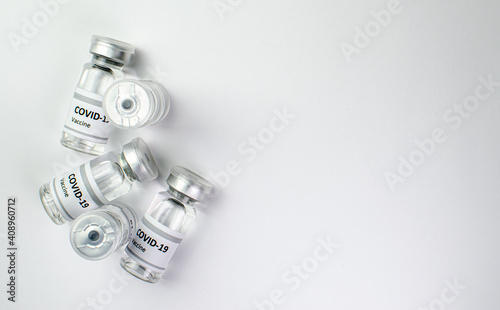 Coronavirus vaccine bottle flipped isolated on black background. Covid-19 situation disease pharmacy in laboratory and drug to cure people. Healthcare and Medical concept. Development of research.