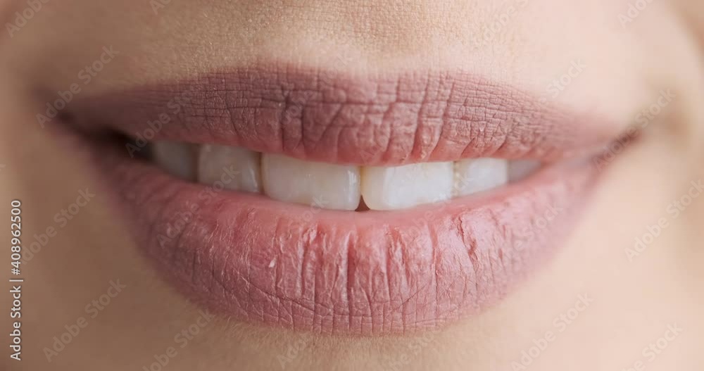 Close up of female mouth kissing and smiling