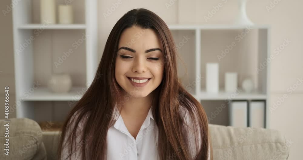 Portrait of beautiful woman smiling at home