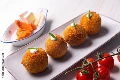 Traditional spanish croquettes from mallorca with sobrassada and cheese