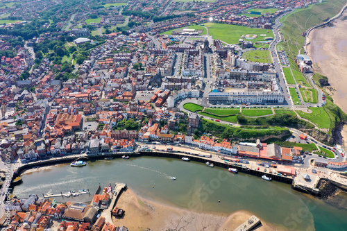 Aerial photo of the beautiful town of Whitby in the UK in North Yorkshire in the UK showing the village centre on a hot summers day