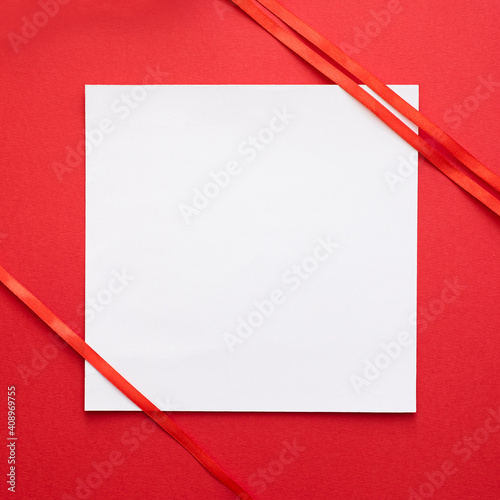 White card with red ribbon decoration