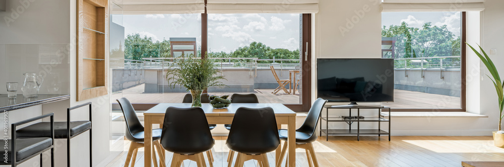 Fototapeta premium Spacious living room with many windows