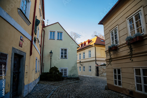 Fascinating narrow picturesque street with baroque and renaissance historical buildings in sunny day, Novy svet, New World in the vicinity of Hradcany, Prague, Czech Republic © AnnaRudnitskaya