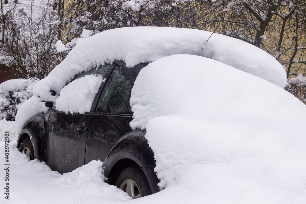 Snow covered car close up