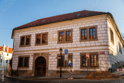 Beautiful renaissance house, facade is richly decorated with figural sgraffito, Palace at Hradcany Square nearby Prague Castle, sunny winter day, Prague, Czech Republic photo