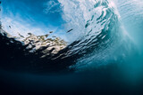 Underwater wave and bubbles. Transparent water and breaking ocean wave