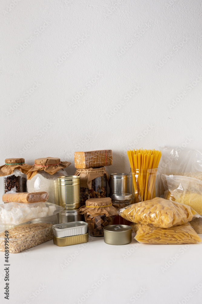 Home food supplies, necessary food for the period of quarantine and isolation, the concept of stay at home, canned food and cereals, various pasta and flour, sugar and cookies, honey and coffee