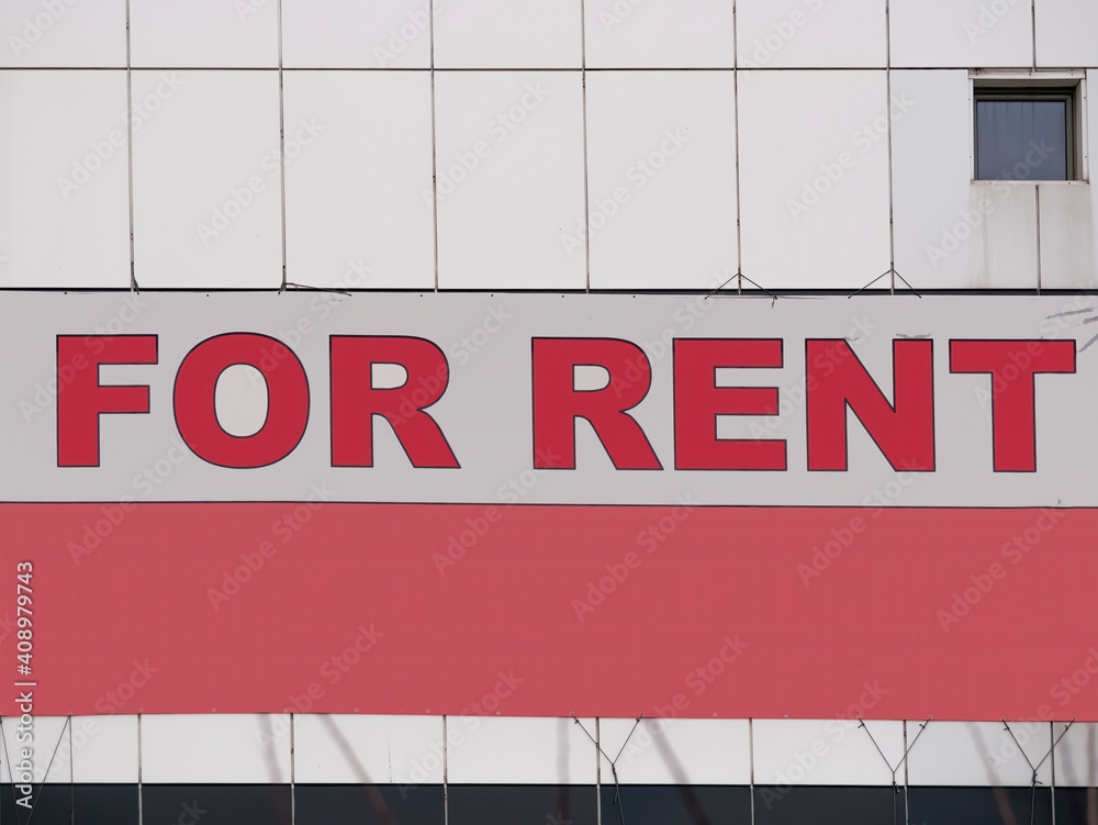 For rent sign board on a office building. For rent sign board on a office building.