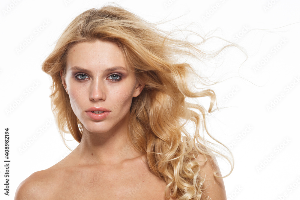 Natural beauty and skincare concept. Portrait of beautiful female model with clean face isolated on white background. Young woman shows healthy sensitive skin after using cosmetics and makeup Natural beauty and skincare concept. Portrait of beautiful female model with clean face isolated on white background. Young woman shows healthy sensitive skin after using cosmetics and makeup