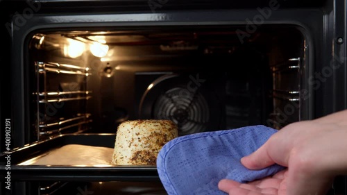 baked ricotta cooking at home in the oven. selective focus home food photo